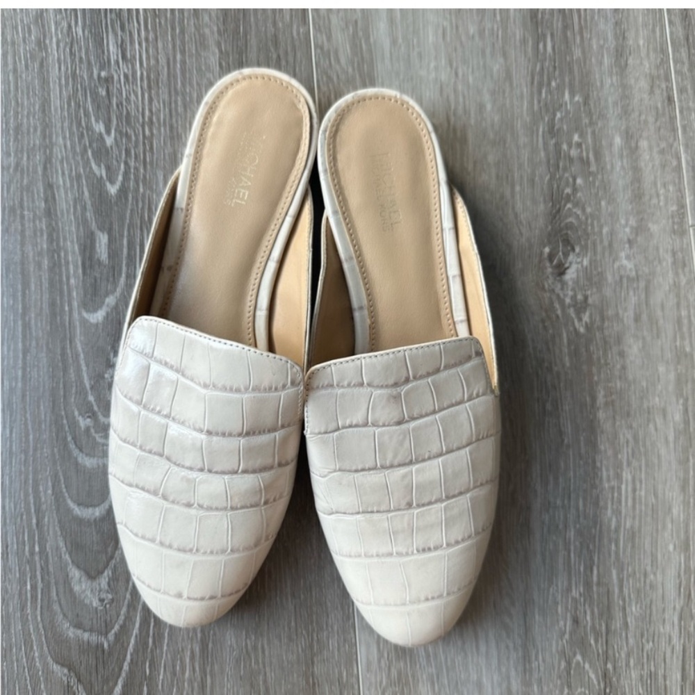 Michael Kors Natasha crocodile embossed leather mules.